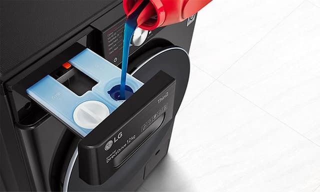 Detergent being poured into a black washing machine (1)