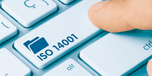 A finger pressing a key on a keyboard with a file symbol and the text ISO 14001