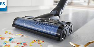 Philips AquaTrio cordless vacuum cleaning the floor