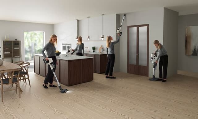 Electrolux- Cleaning-Woman using a stick vacuum cleaner from Electrolux