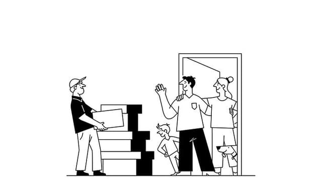 Man carrying boxes into a home