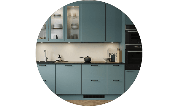 Round image of a Trend kitchen with Petrol coloured fronts