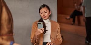 Woman looking at Pixel phone