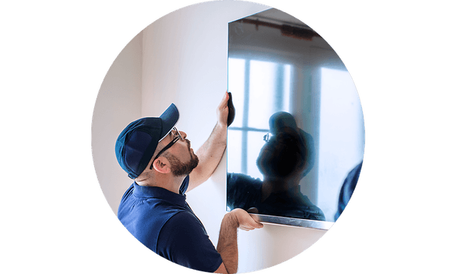 CS-Installation-Man placing a TV on a wall