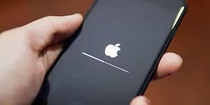 Apple iPhone showing its screen with Apple logo