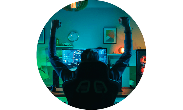 CS-Gaming insurance- Man raising hands while gaming