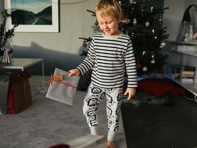 Boy holding Christmas gift