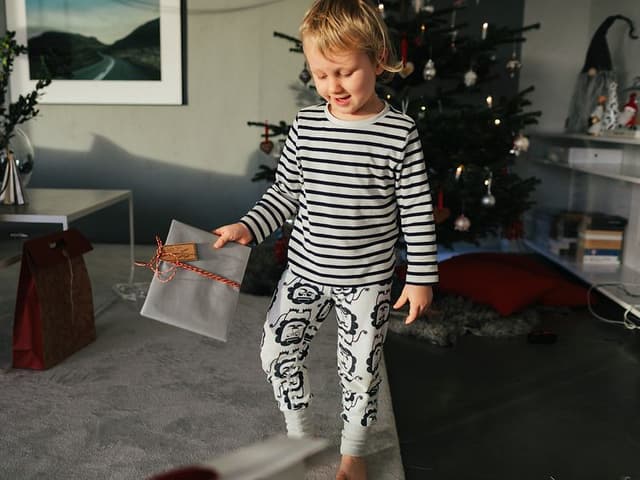 Boy holding Christmas gift