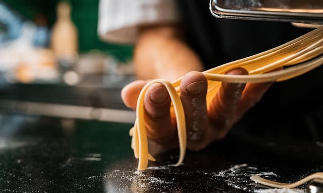 Chef shaping pasta
