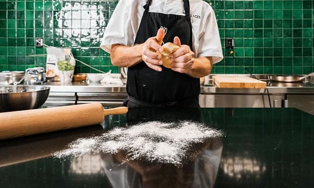 Chef kneading pasta dough