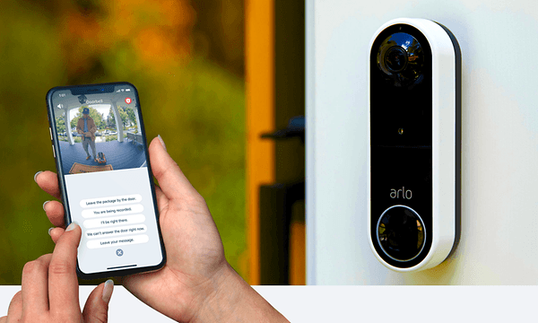 Arlo - woman checking security camera on her phone