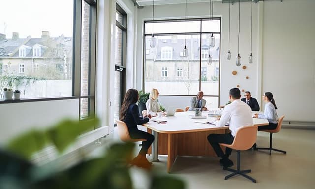 Collegues in an open meeting room