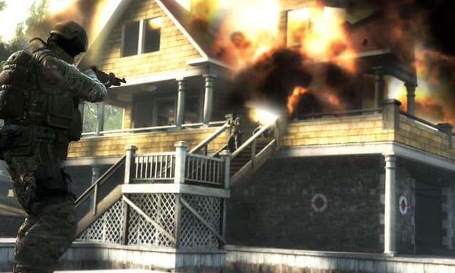 CS-GO screenshot of one counter terrorist and terrorist in front of exploding house