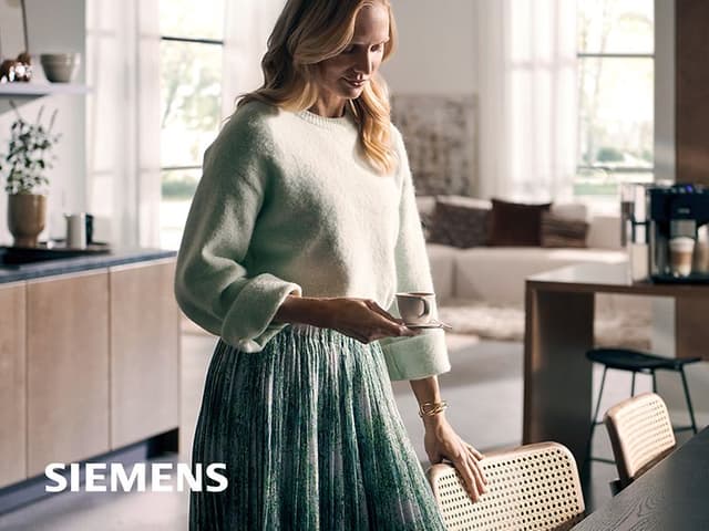 Woman about to sit down to enjoy a cup of espresso