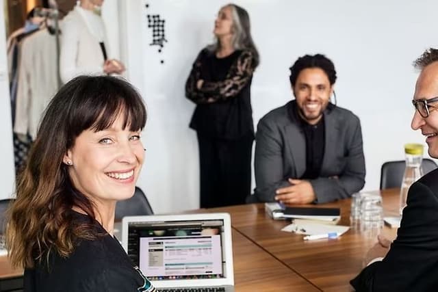 woman-and-two-men-sitting-at-a-c