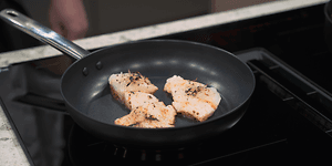 Fish being fried on a frying pan