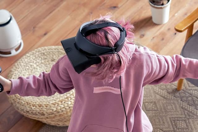 Woman-VR-gaming-in-a-living-room