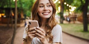 Woman smiling with phone