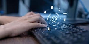 Computing - VPN - Person using a computer with the word VPN in front of them