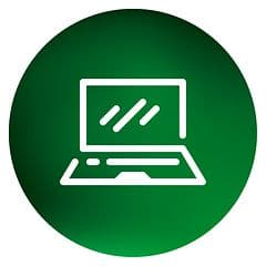 Pyöreä tietokonepalveluiden ikoni, jossa valkoisen kannettavan ääriviivat vihreällä pohjalla