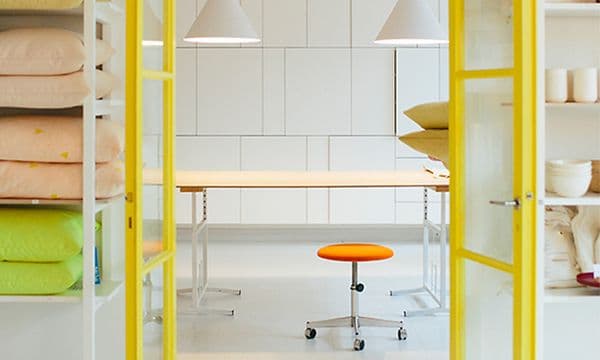Shop with two open yellow doors