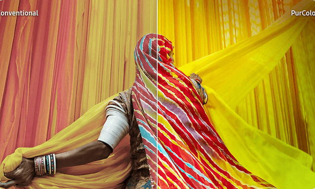 Samsung TV with PurColor and a woman surrounded by colourful yellow and orange fabrics