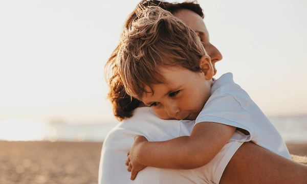 MDA - Beko - Woman holding baby at the beach