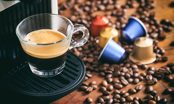 Cup of espresso plus capsules