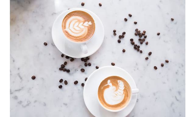 Two coffee cups on a table