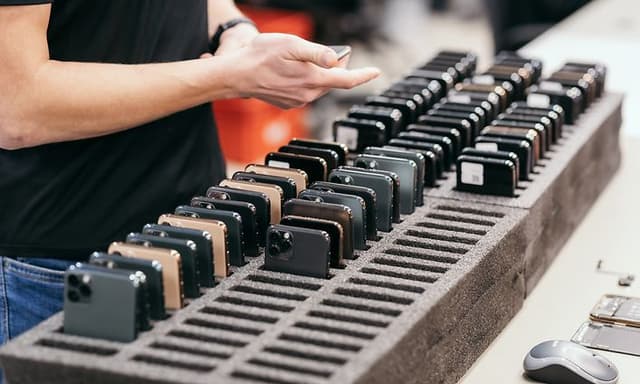 Used mobile phones in a stand