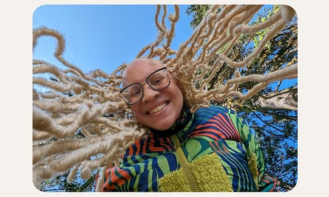 Woman with dreadlocks smiling