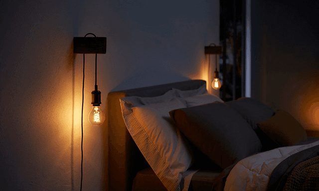 Philips Hue lightbulbs used to light up the sides of a bed
