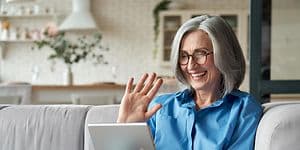 Woman smiling at tablet