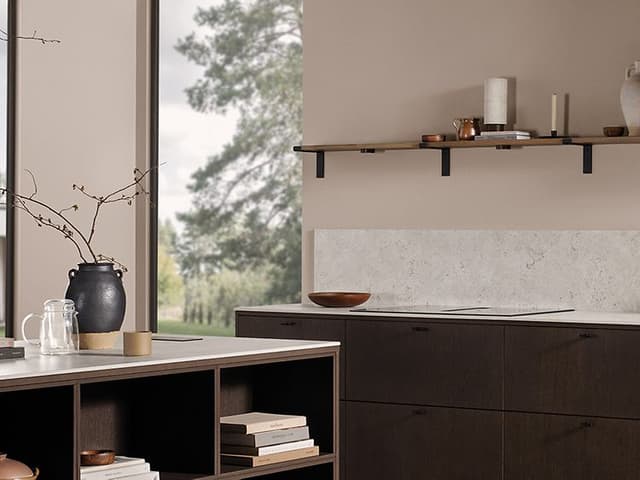 Dark oak kitchen with a white worktop