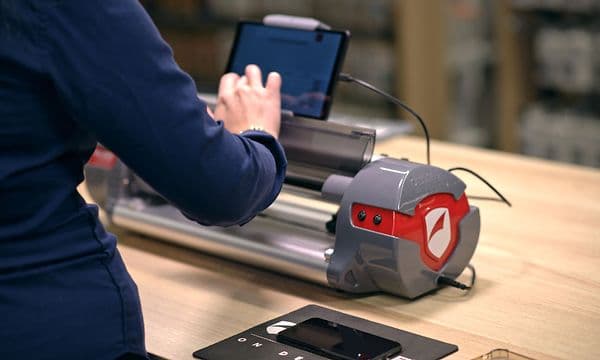 Elgiganten employee using ZAGG in store