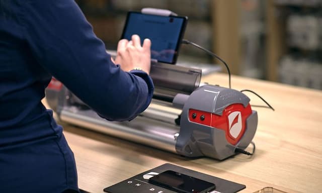 Elgiganten employee using ZAGG in store