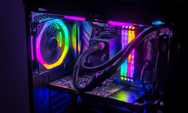 Open desktop PC with visible components and RGB-lighting