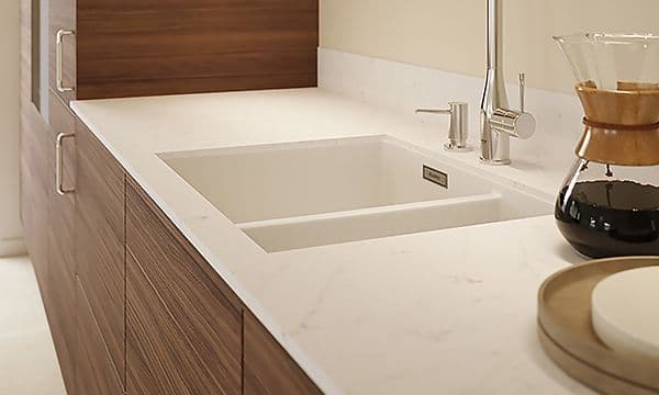 Wooden Epoq Kitchen with white Silestone worktop and tailored solutions