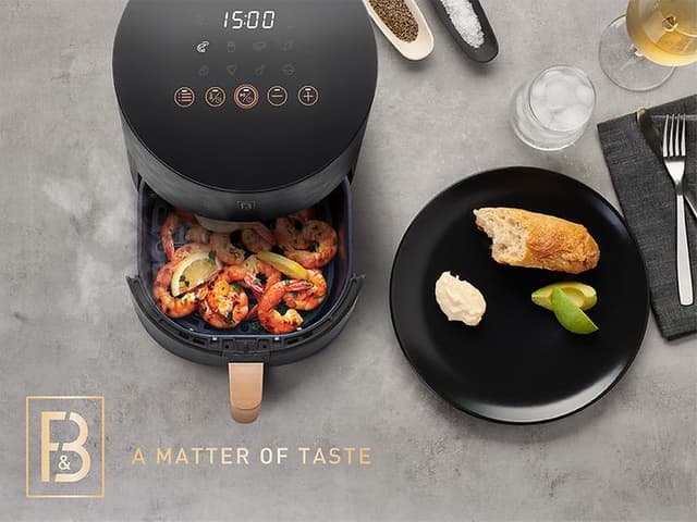 Airfryer med stegte rejer og teksten A matter of taste