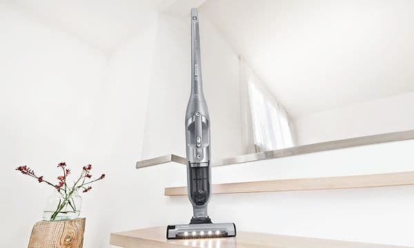 Bosch Serie 4 Flexxo cordless vacuum cleaner parked at a stair in a modern house