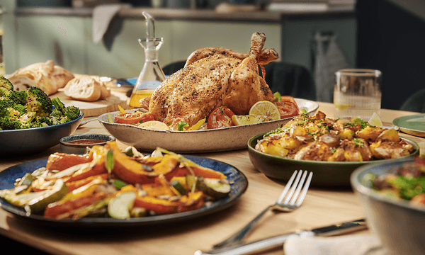 A variety of foods prepared in the Philips Combi XXL Airfryer using automatic cooking programs