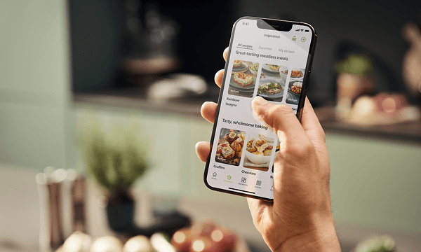 The Philips Combi XXL Airfryer's NutriU app shown on a smartphone