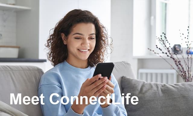 Woman using the Hisesnse ConnectLife ecosystem at her phone