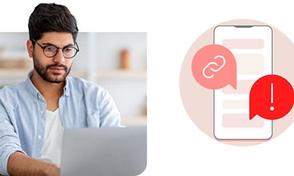 Mand, der arbejder på en bærbar computer og et symbol for falske beskeder