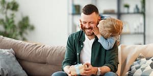 Man receiving a present from his son on Father's Day