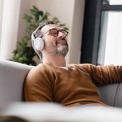 Man enjoying music with headphones on
