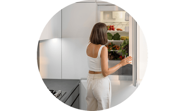 Woman opening refrigerator