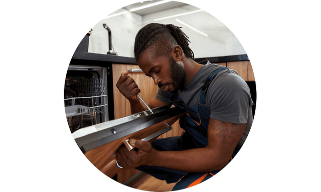 Man repairing dishwasher