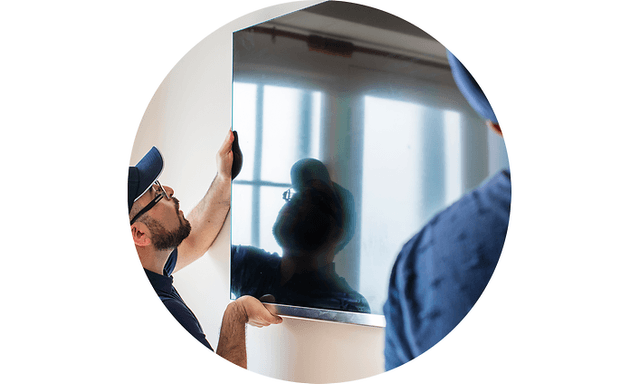 Men installing TV on wall