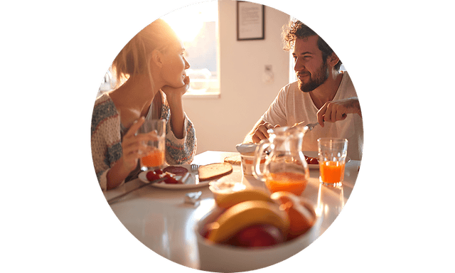 couple having breakfast in kitchen